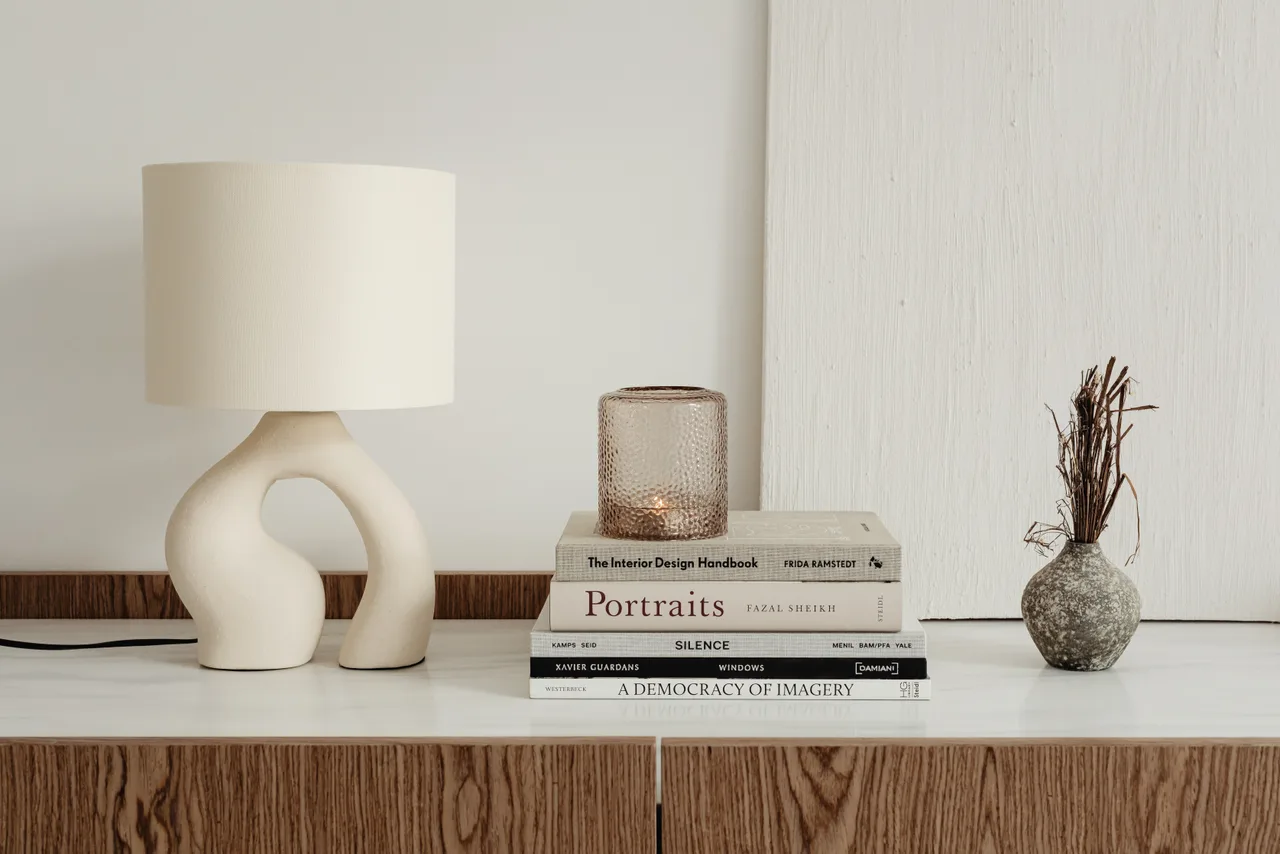 console vignette with lamp + books, generic stock